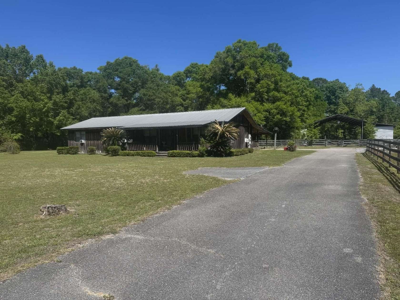 6.5 Acres of Land with Home for Sale in Laurel Hill, Florida