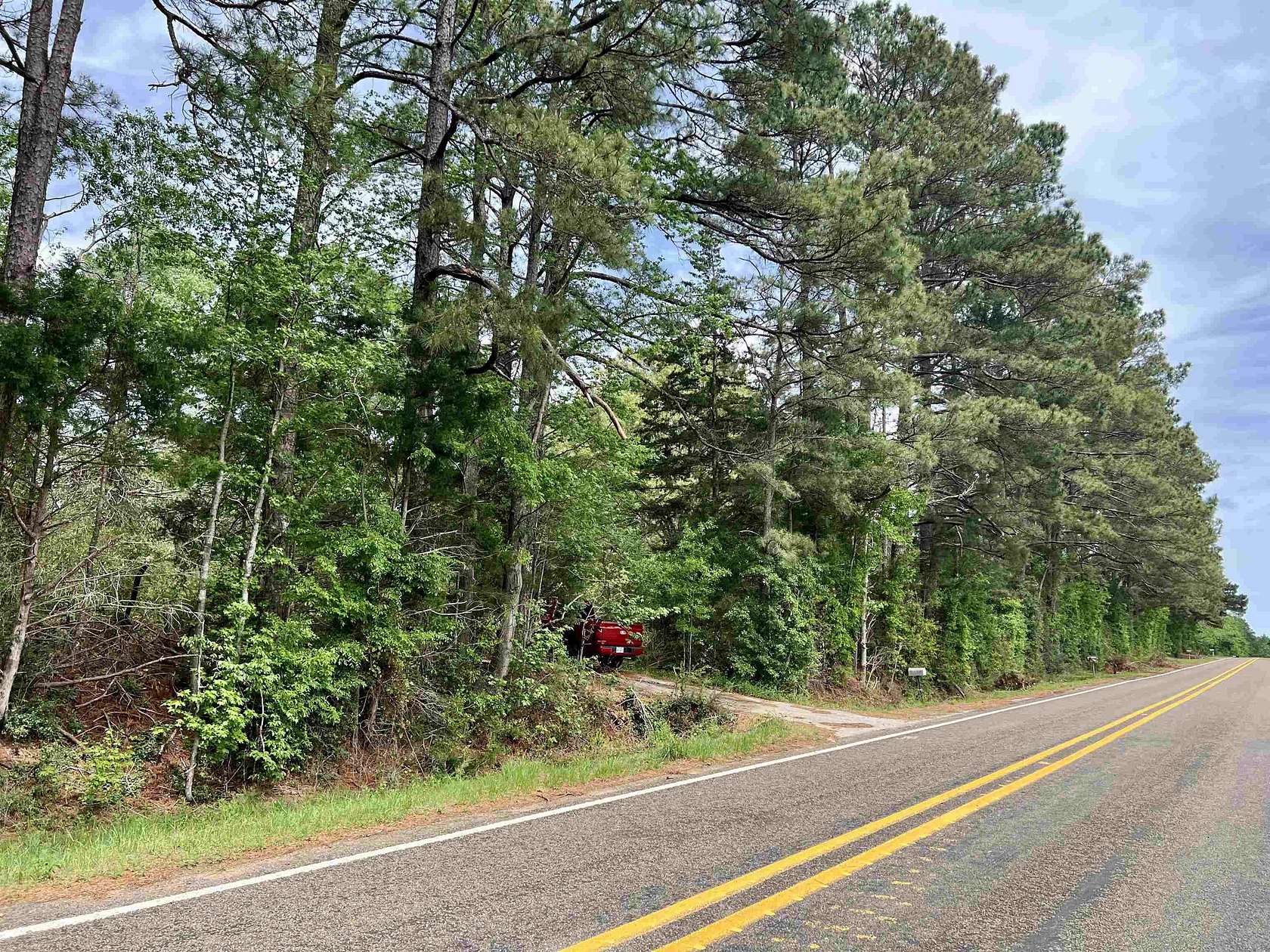10.7 Acres of Land with Home for Sale in Henderson, Texas