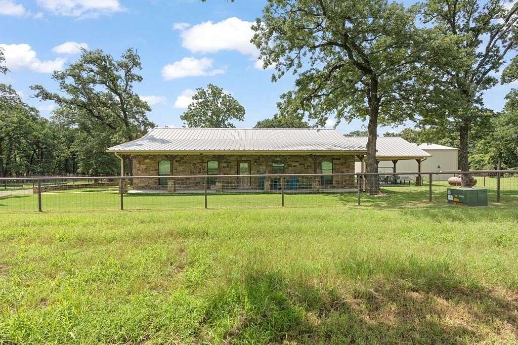10 Acres of Recreational Land with Home for Sale in Covington, Texas