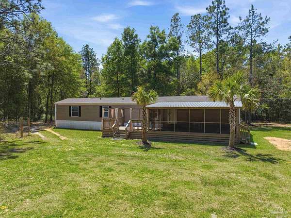 1.6 Acres of Land with Home for Sale in Milton, Florida