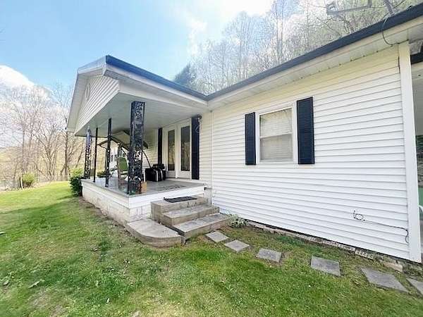 14 Acres of Land with Home for Sale in Belcher, Kentucky