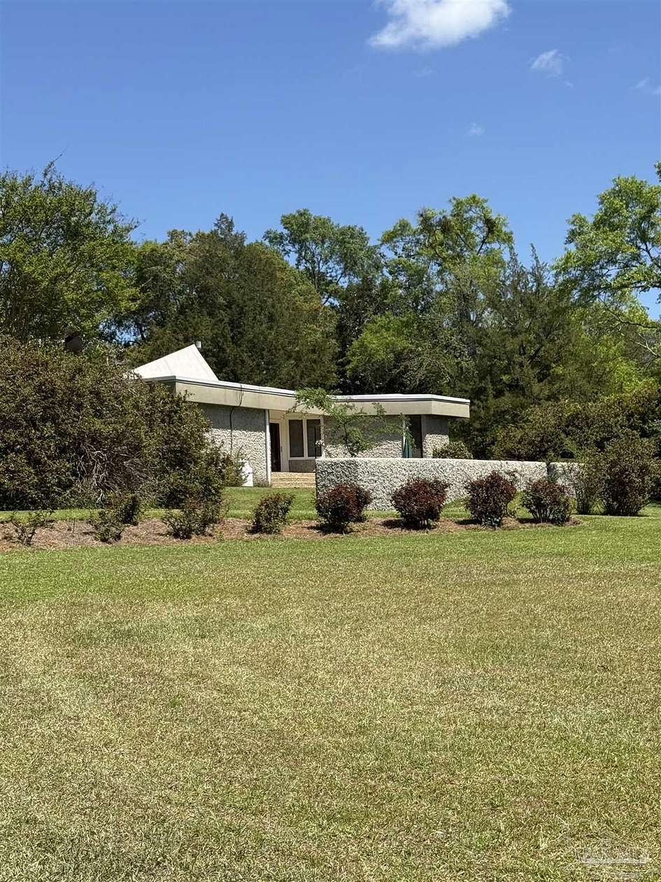 16.3 Acres of Land with Home for Sale in Molino, Florida