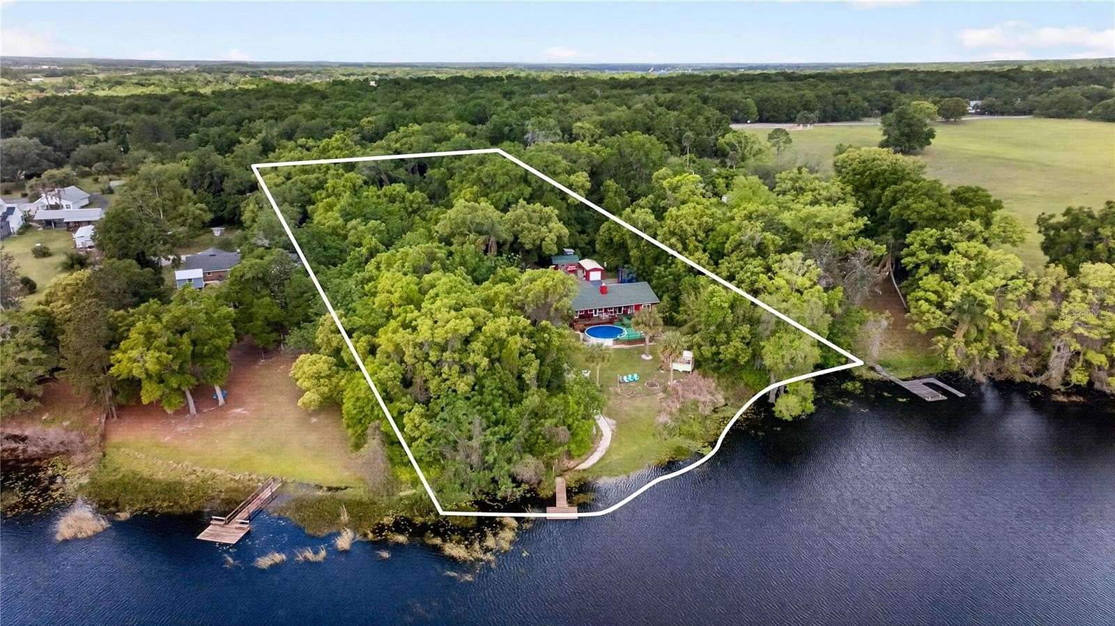 5 Acres of Land with Home for Sale in Zellwood, Florida