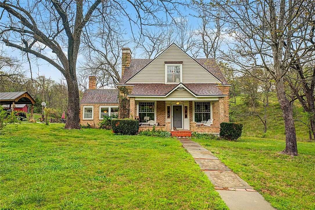 9.7 Acres of Land with Home for Auction in Rogers, Arkansas