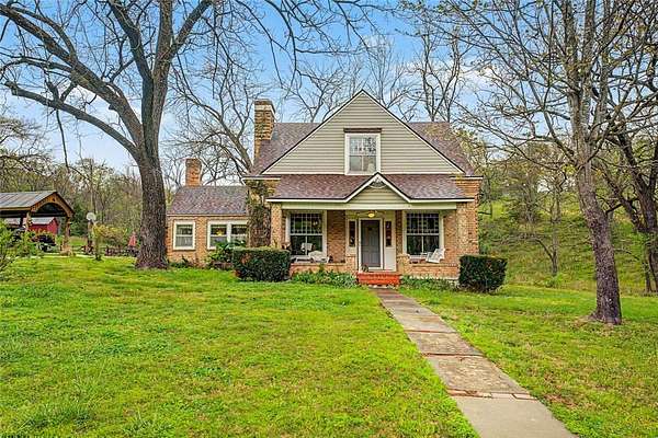 9.7 Acres of Land with Home for Auction in Rogers, Arkansas