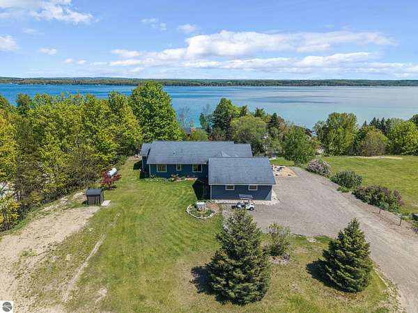 3.5 Acres of Land with Home for Sale in Kewadin, Michigan