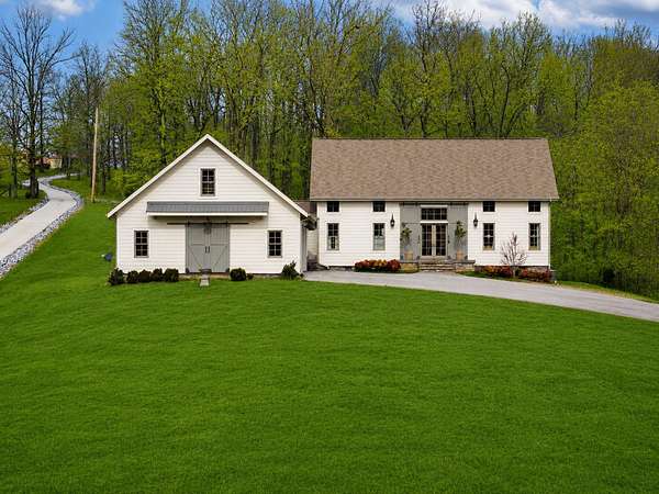 9.7 Acres of Land with Home for Sale in Dickson, Tennessee