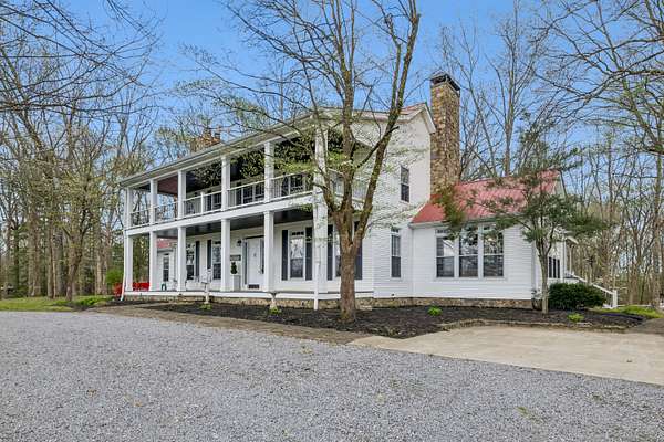 86 Acres of Land with Home for Sale in Charlotte, Tennessee