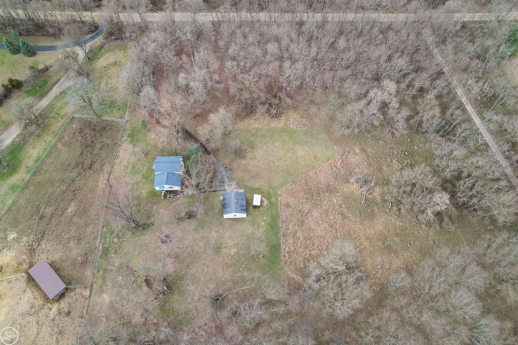 5.6 Acres of Land with Home for Sale in Grass Lake, Michigan