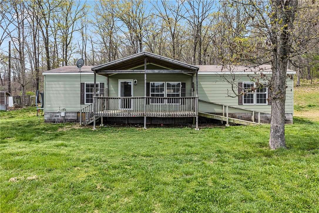 22.7 Acres of Land with Home for Sale in Seligman, Missouri