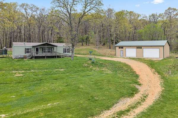 22.7 Acres of Land with Home for Sale in Seligman, Missouri
