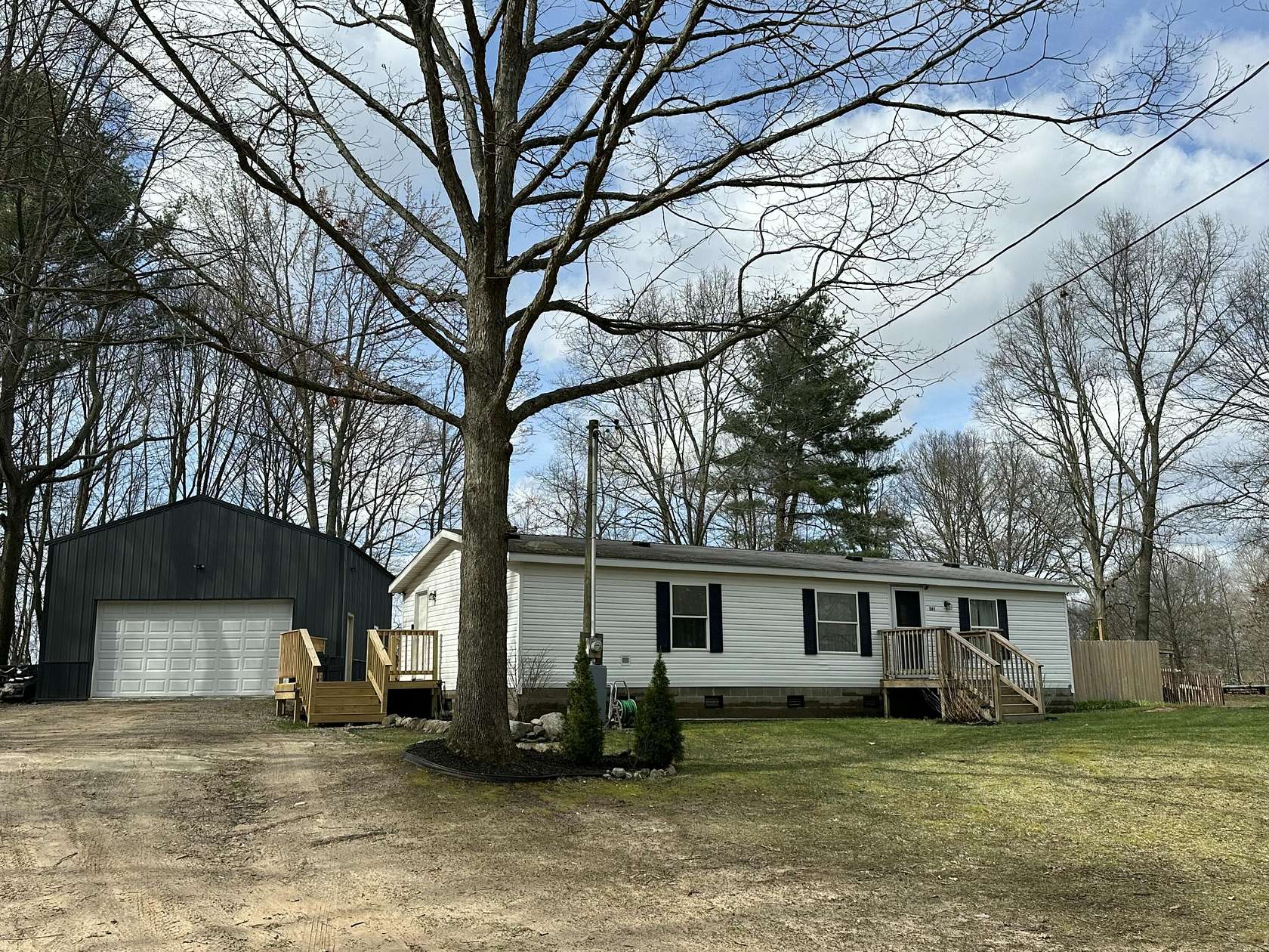 1.76 Acres of Land with Home for Sale in Grant, Michigan