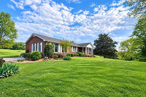 9.47 Acres of Land with Home for Sale in Brush Creek, Tennessee