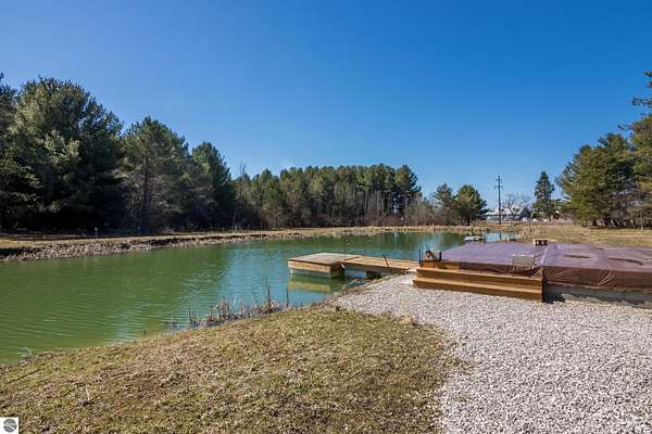 7 Acres of Residential Land for Sale in Kewadin, Michigan