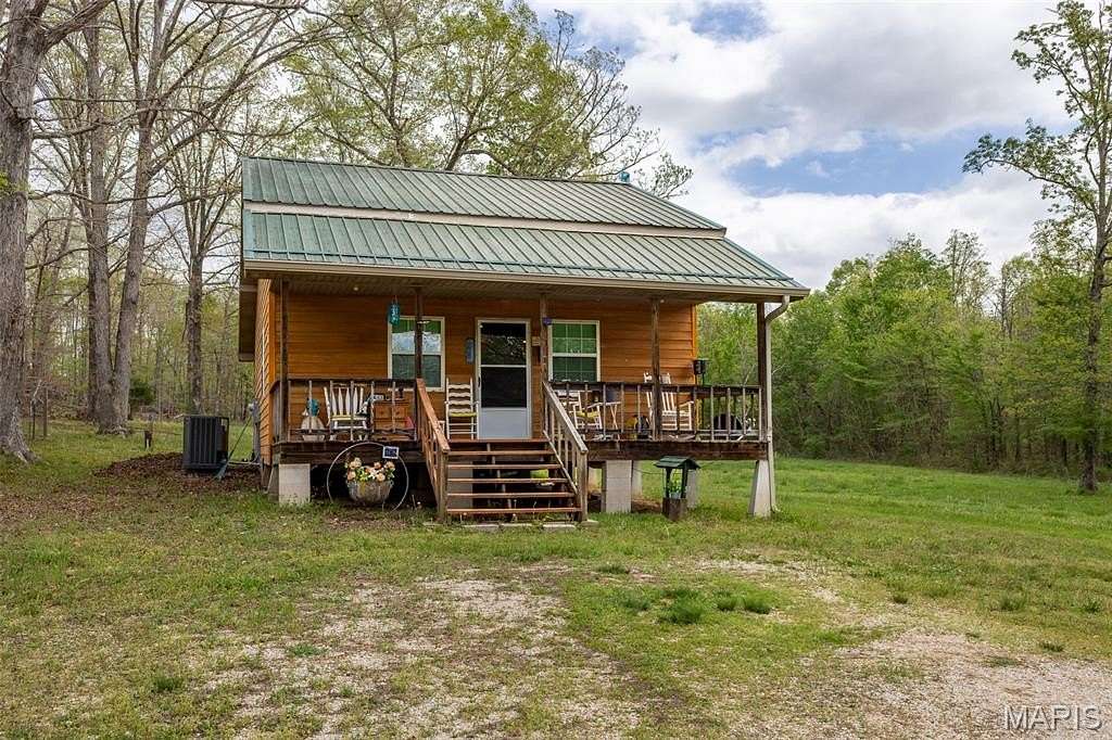 64 Acres of Land with Home for Sale in Fairdealing, Missouri