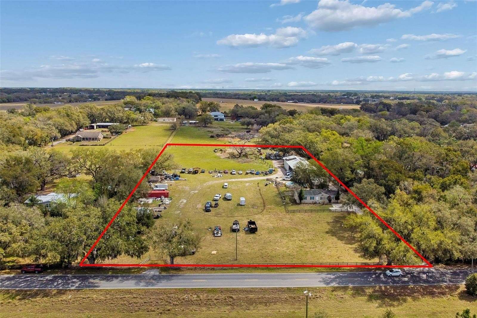 4.89 Acres of Land with Home for Sale in Zephyrhills, Florida