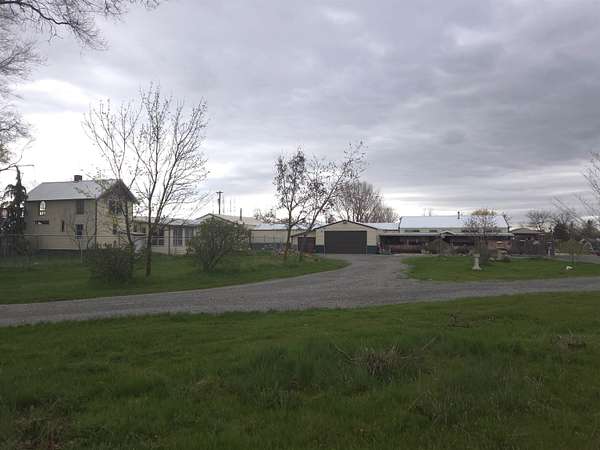 5.58 Acres of Land with Home for Sale in Otis Orchards, Washington