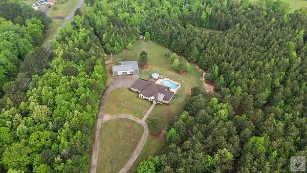 36.4 Acres of Land with Home for Sale in Atlanta, Texas