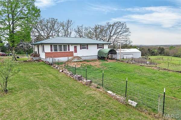 10 Acres of Land with Home for Sale in Stoutland, Missouri