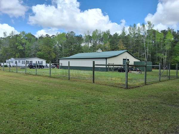 24.2 Acres of Land with Home for Sale in Tabor City, North Carolina