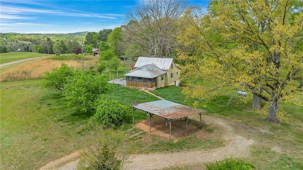 8.6 Acres of Land with Home for Sale in Roaring River, North Carolina