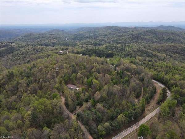 15.4 Acres of Land with Home for Sale in Millers Creek, North Carolina