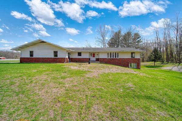 16 Acres of Land with Home for Sale in Clarklake, Michigan