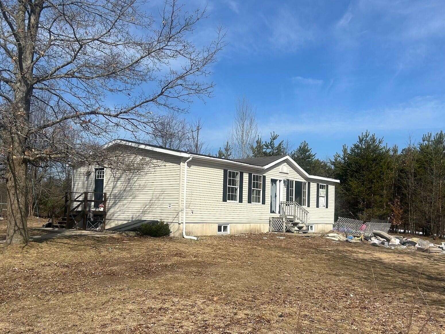 2 Acres of Land with Home for Sale in Boon, Michigan