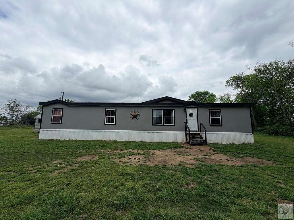2 Acres of Land with Home for Sale in De Kalb, Texas