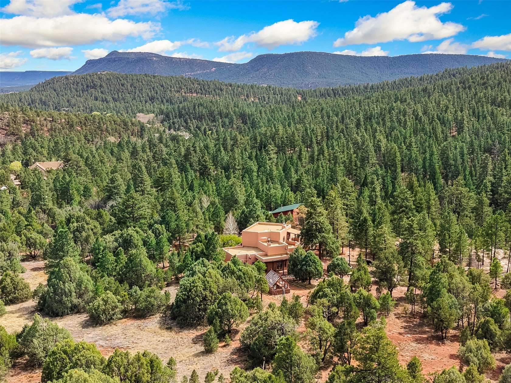 27.8 Acres of Recreational Land with Home for Sale in Glorieta, New Mexico