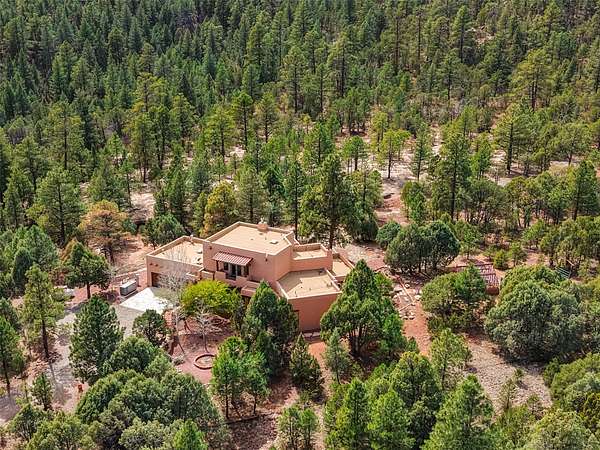 27.8 Acres of Recreational Land with Home for Sale in Glorieta, New Mexico