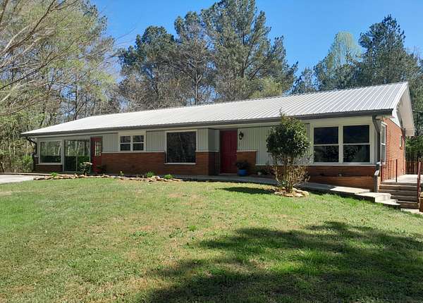 7.69 Acres of Land with Home for Sale in Copperhill, Tennessee