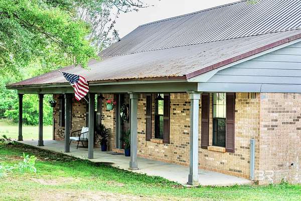 5 Acres of Land with Home for Sale in Irvington, Alabama