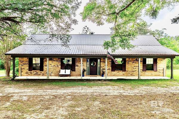 5 Acres of Land with Home for Sale in Irvington, Alabama