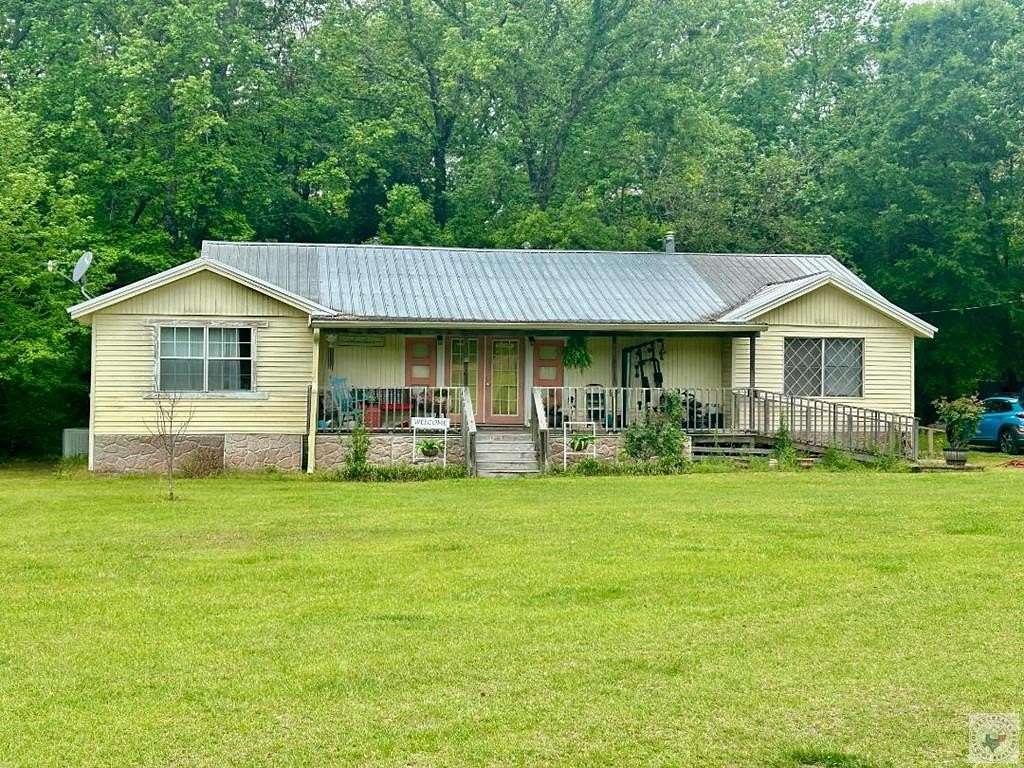 10 Acres of Recreational Land with Home for Sale in Naples, Texas