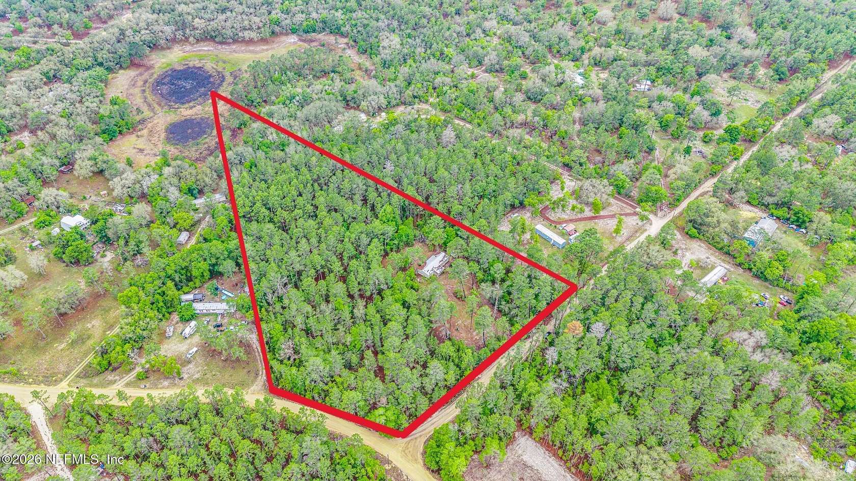 6.89 Acres of Land with Home for Sale in Melrose, Florida