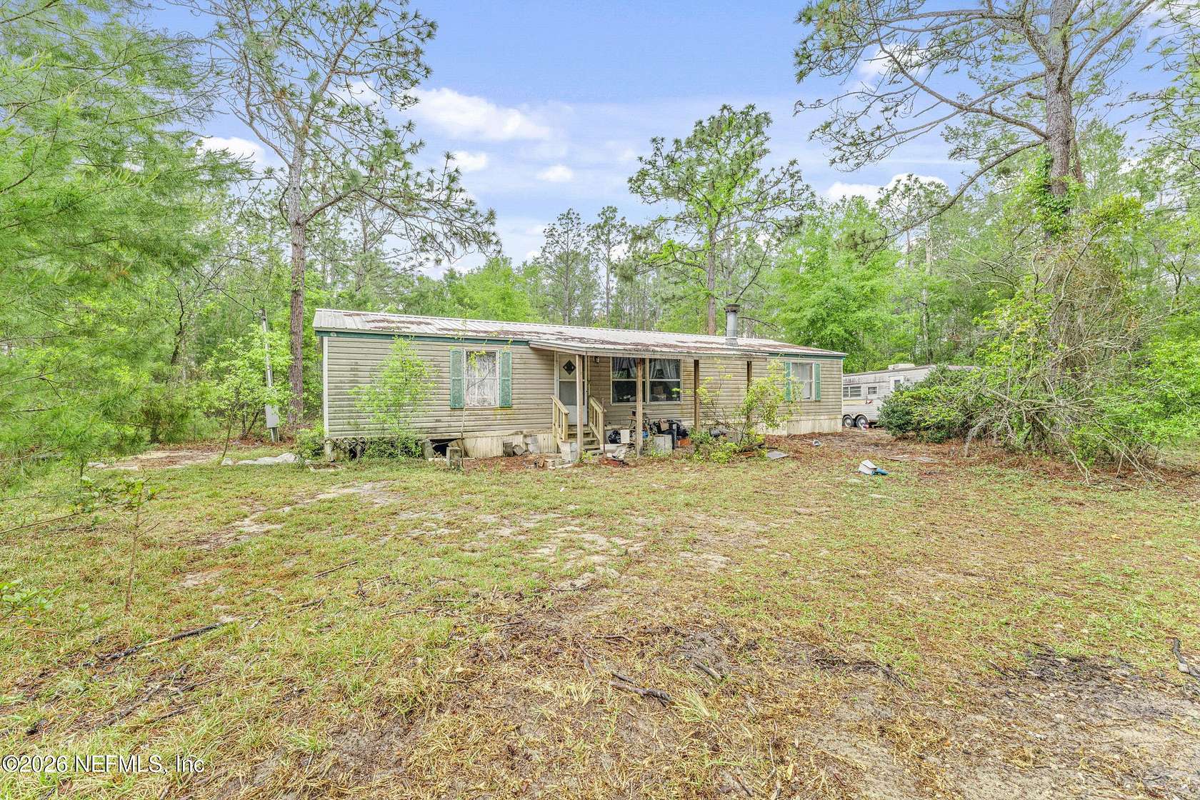 6.89 Acres of Land with Home for Sale in Melrose, Florida