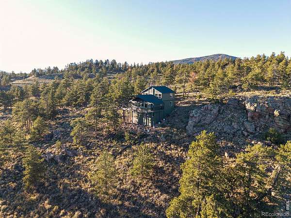 5.63 Acres of Land with Home for Sale in Red Feather Lakes, Colorado