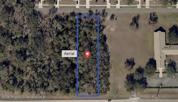 0.9 Acres of Commercial Land for Sale in Spring Hill, Florida