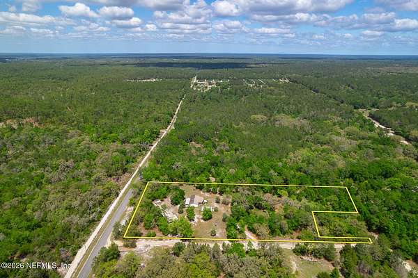4.56 Acres of Land with Home for Sale in Crescent City, Florida