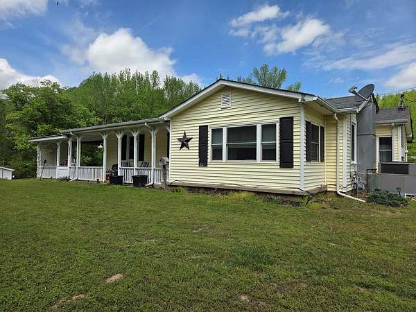 5.7 Acres of Land with Home for Sale in Paris, Tennessee