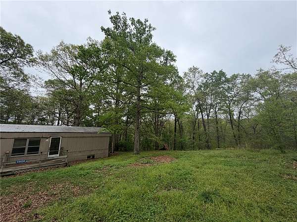 6 Acres of Land with Home for Sale in Gravette, Arkansas