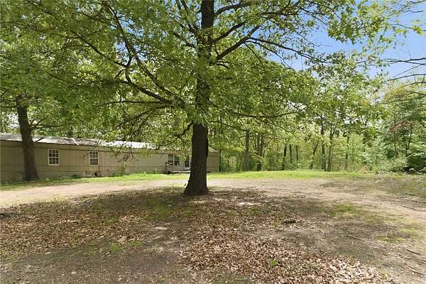 6 Acres of Land with Home for Sale in Gravette, Arkansas