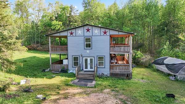 17.4 Acres of Land with Home for Sale in Linden, Tennessee