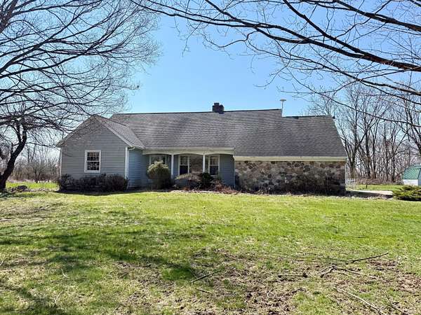 7 Acres of Land with Home for Sale in Saranac, Michigan