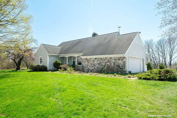 7 Acres of Land with Home for Sale in Saranac, Michigan