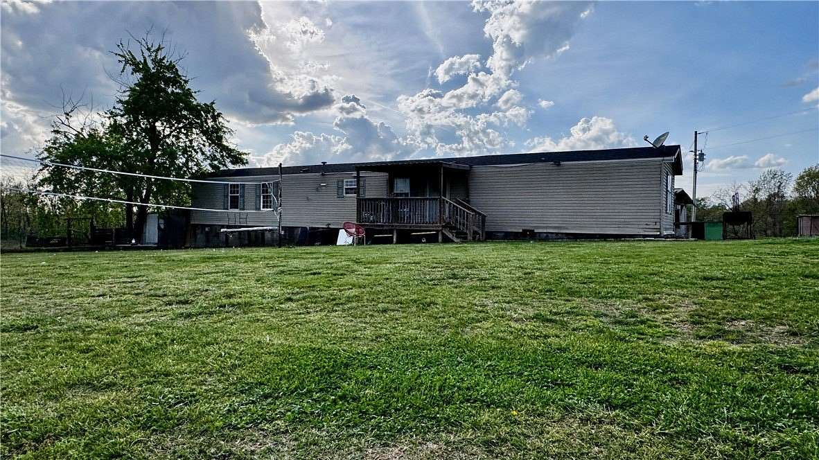 5.58 Acres of Land with Home for Sale in Garfield, Arkansas