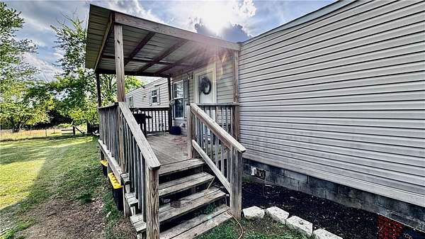 5.58 Acres of Land with Home for Sale in Garfield, Arkansas