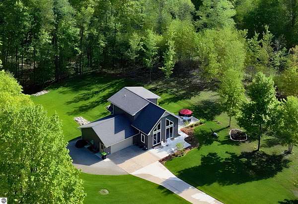 5 Acres of Land with Home for Sale in Cedar, Michigan