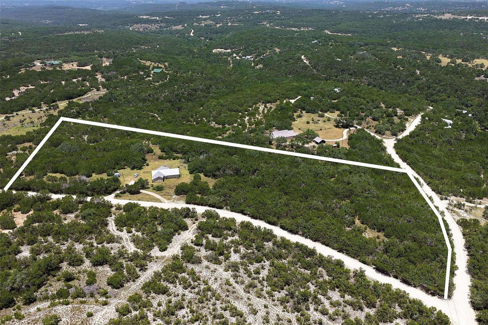 12.8 Acres of Land with Home for Sale in Dripping Springs, Texas